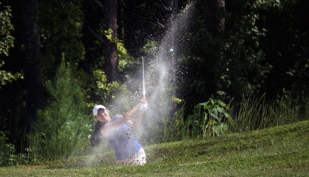 Air Force 1st Lt. Kimberly Lui of Minot AFB, N.D. lands an amazing shot out of the bunker for par during the final day of the 2022 Armed Forces Golf Championship hosted by Army at Fort Belvoir, Virgina. Championship features teams from the Army, Marine Corps, Navy (with Coast Guard players), and Air Force (with Space Force players). Department of Defense Photo by Mr. Steven Dinote - Released.